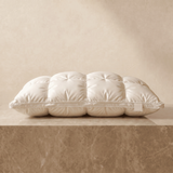 Down alternative pillow on a marble plinth, baffle-box construction