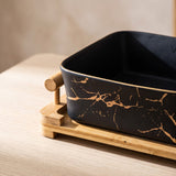 Close-up of the European Serving Bowl (Black) gold marble glaze