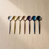 Istanbul Teaspoon — jewel-toned teaspoons on a warm wood table