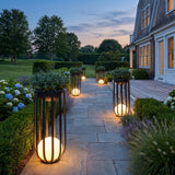 Flower Pot Lamps lighting a bluestone garden path at dusk