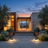 A matched pair of Flat Out Lights lighting a front entrance at dusk