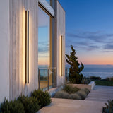 Outdoor Sleek Wall Light mounted on an exterior wall, washing the surface with warm light at dusk