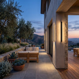 Outdoor Sleek Wall Light mounted above outdoor lounge seating at dusk