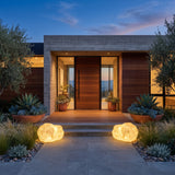 A matched pair of Vibrant Stone Outdoor Light lighting a front entrance at dusk
