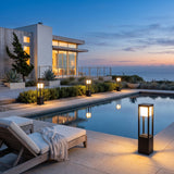 Nimbus Cube Solar Light lining a poolside terrace at dusk