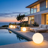 Element Lamp lining a poolside terrace at dusk