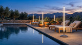 Modern Outdoor Floor Lamp Pro glowing at dusk by a poolside