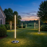 Modern Outdoor Floor Lamp Pro on a lawn at dusk
