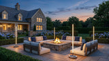 Lamps lighting a patio firepit setting at dusk