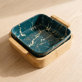 European Serving Bowl (Green) — teal marble bowl on a bamboo cradle