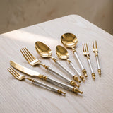 Close-up of the Noble Golden Cutlery Set gold heads and baroque handles