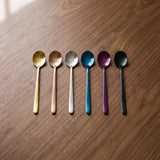 Dubai Dessert Spoon — jewel-toned dessert spoons on a warm wood table