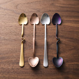 Rome Mixing Spoon Set — jewel-toned mixing spoons on a warm wood table