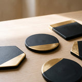 Close-up of the Onyx Coaster black and gold