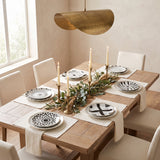 Jabr Plate Collection styled in a warm dining room