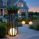Tall Flower Pot Lamp solar lantern with a planted bowl, glowing on an estate terrace at dusk