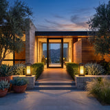A matched pair of Cage Post Light (Outdoor Solar) lighting a front entrance at dusk