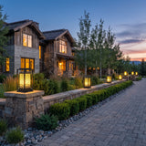 Cage Post Light (Outdoor Solar) on masonry gate piers at dusk