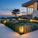 Cage Post Light (Outdoor Solar) set among garden planting at dusk