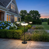 Signature Outdoor Solar Lamp glowing on a luxury estate terrace at dusk