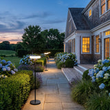 Signature Outdoor Solar Lamp lighting a stone garden path at dusk
