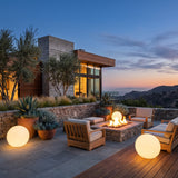 Element Lamp around an outdoor fire pit seating area at dusk