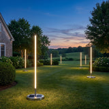 Modern Outdoor Floor Lamp Pro on a lawn at dusk
