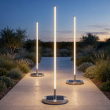 Lamps by a water feature in daylight